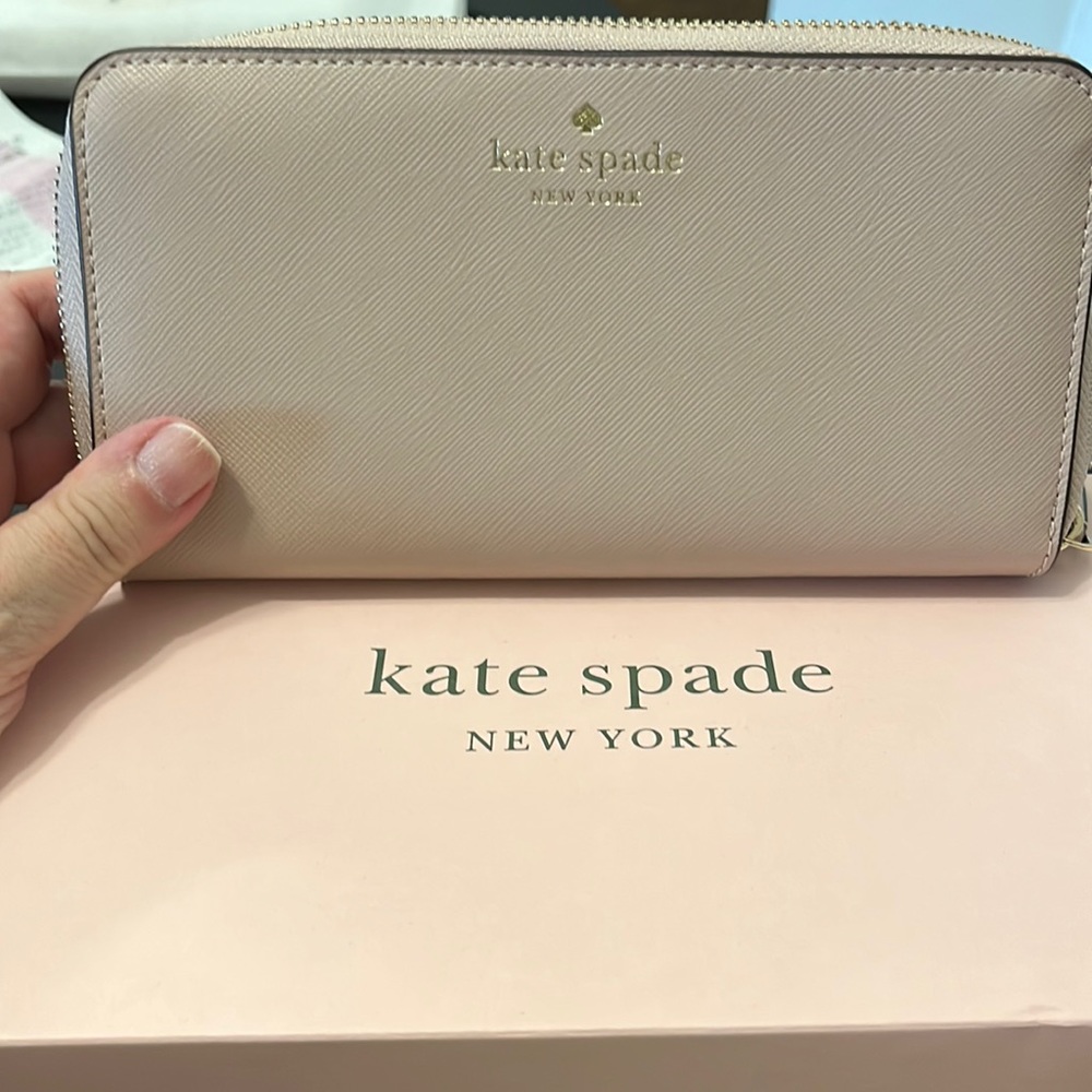 Kate spade wallet. Never used. Brand new with box and tag. Beautiful warm beige